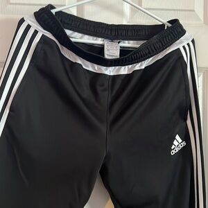 Adidas track pants.